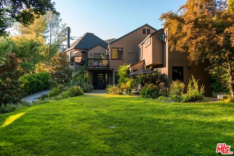an aerial view of a house with a garden
