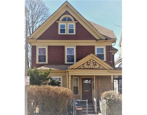 a view of a brick house with large windows