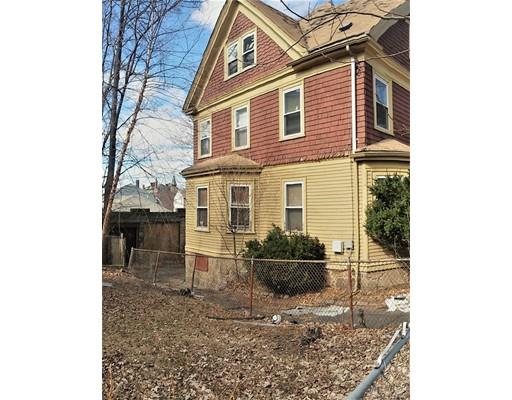 2 Dunford Street Boston, MA 02119 - Photo 2 of 4 a front view of a house with a garden