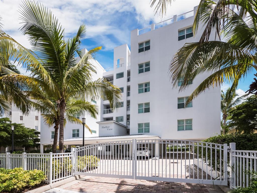 650 Golden Gate Point, Unit 503 Sarasota, FL 34236 - Photo 1 of 1 a view of a palm trees with wooden fence
