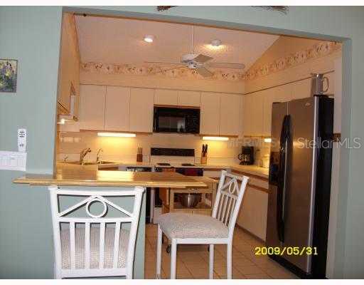 Aerial View - Spacious kitchen with breakfast bar, recently updated and new stainsteel refrigerator.