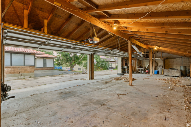 875 Cedar Hollow Road Lehi, UT 84043 - Photo 30 of 76 Concrete flooring with exposed wood beam ceiling and exposed structural supports
