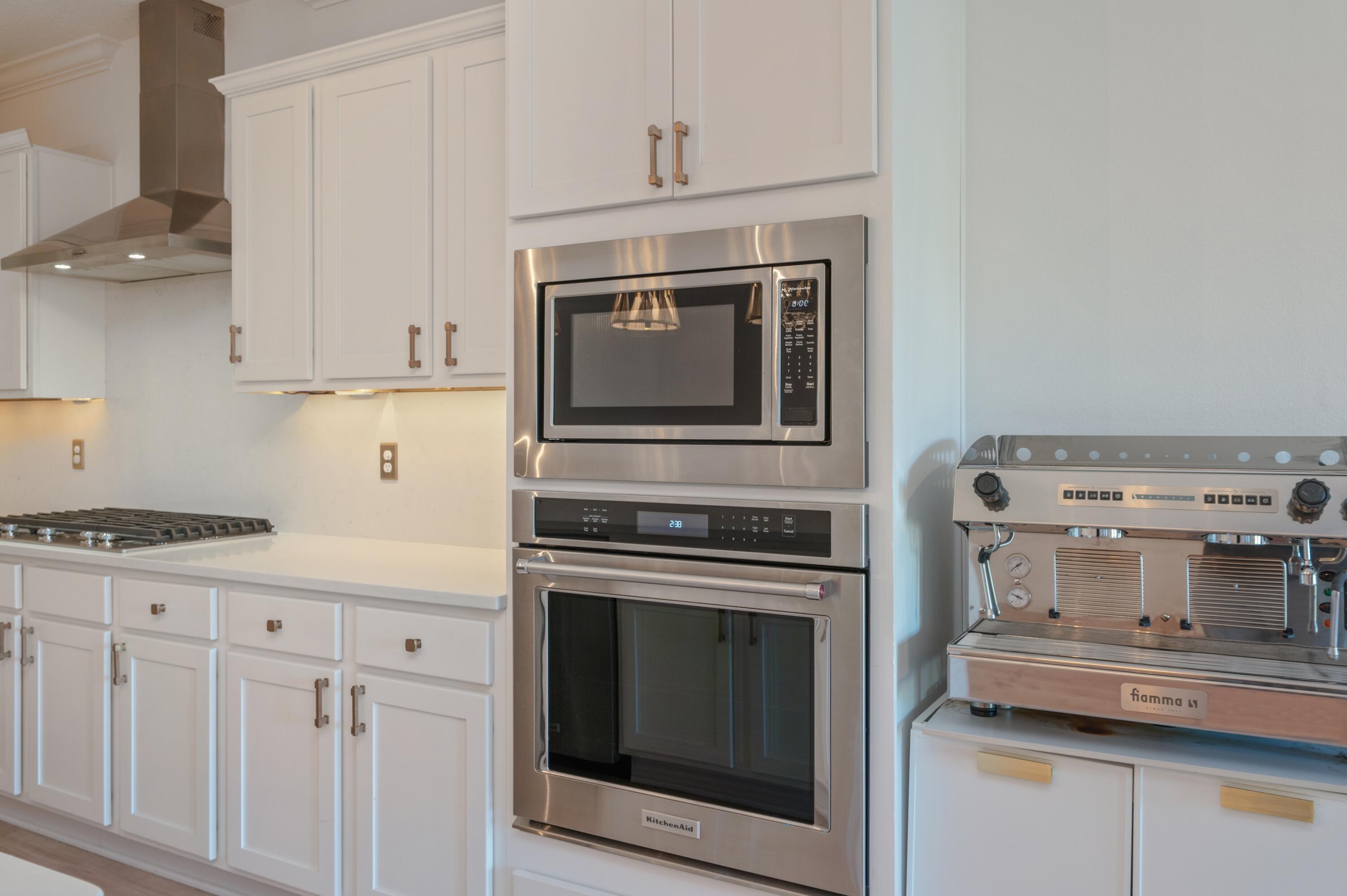 53 Palmer Lane Santa Rosa Beach, FL 32459 - Photo 13 of 62 a kitchen with granite countertop white cabinets and appliances