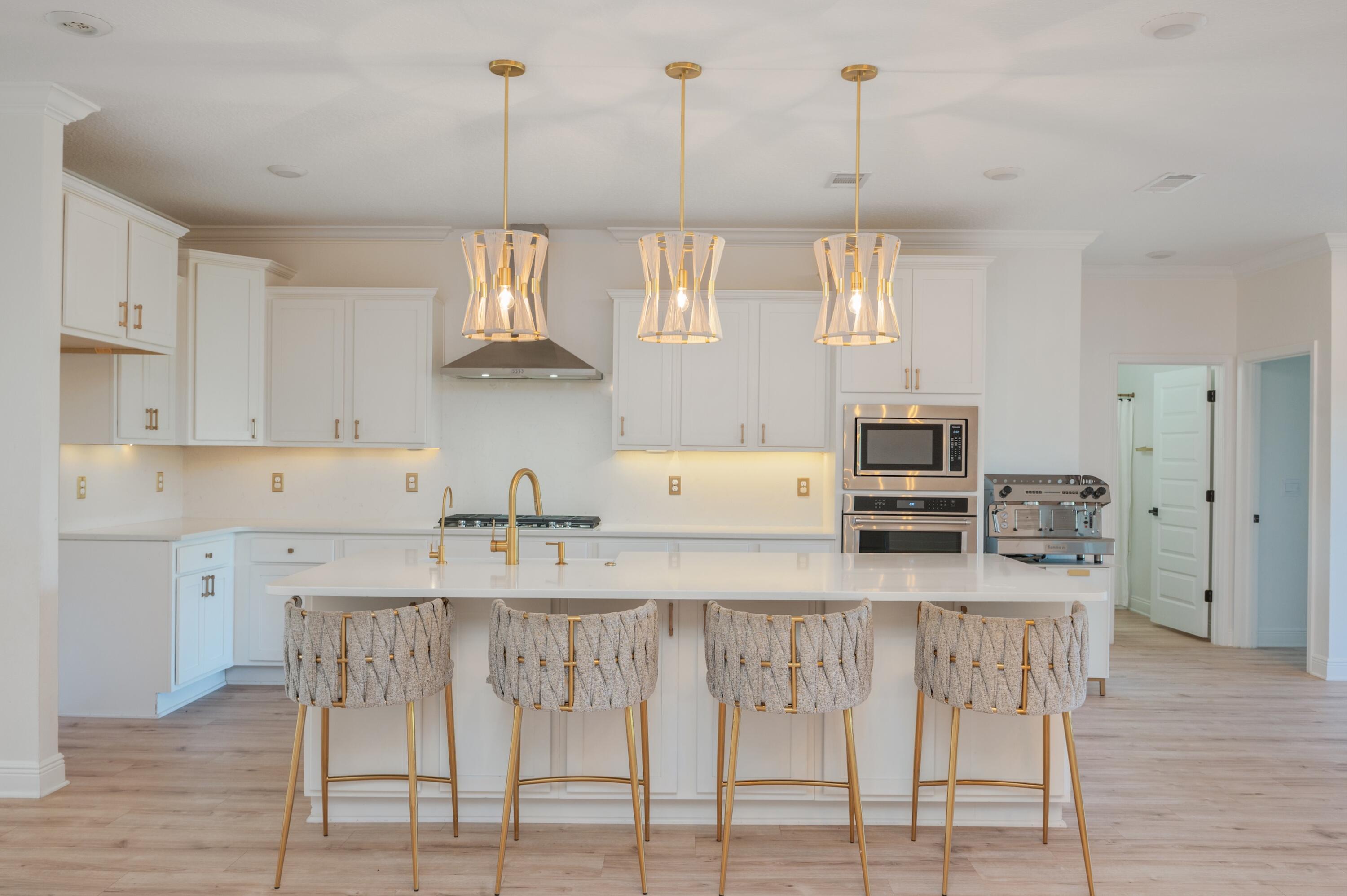 53 Palmer Lane Santa Rosa Beach, FL 32459 - Photo 15 of 62 a kitchen with stainless steel appliances granite countertop a kitchen island a stove a table and chairs