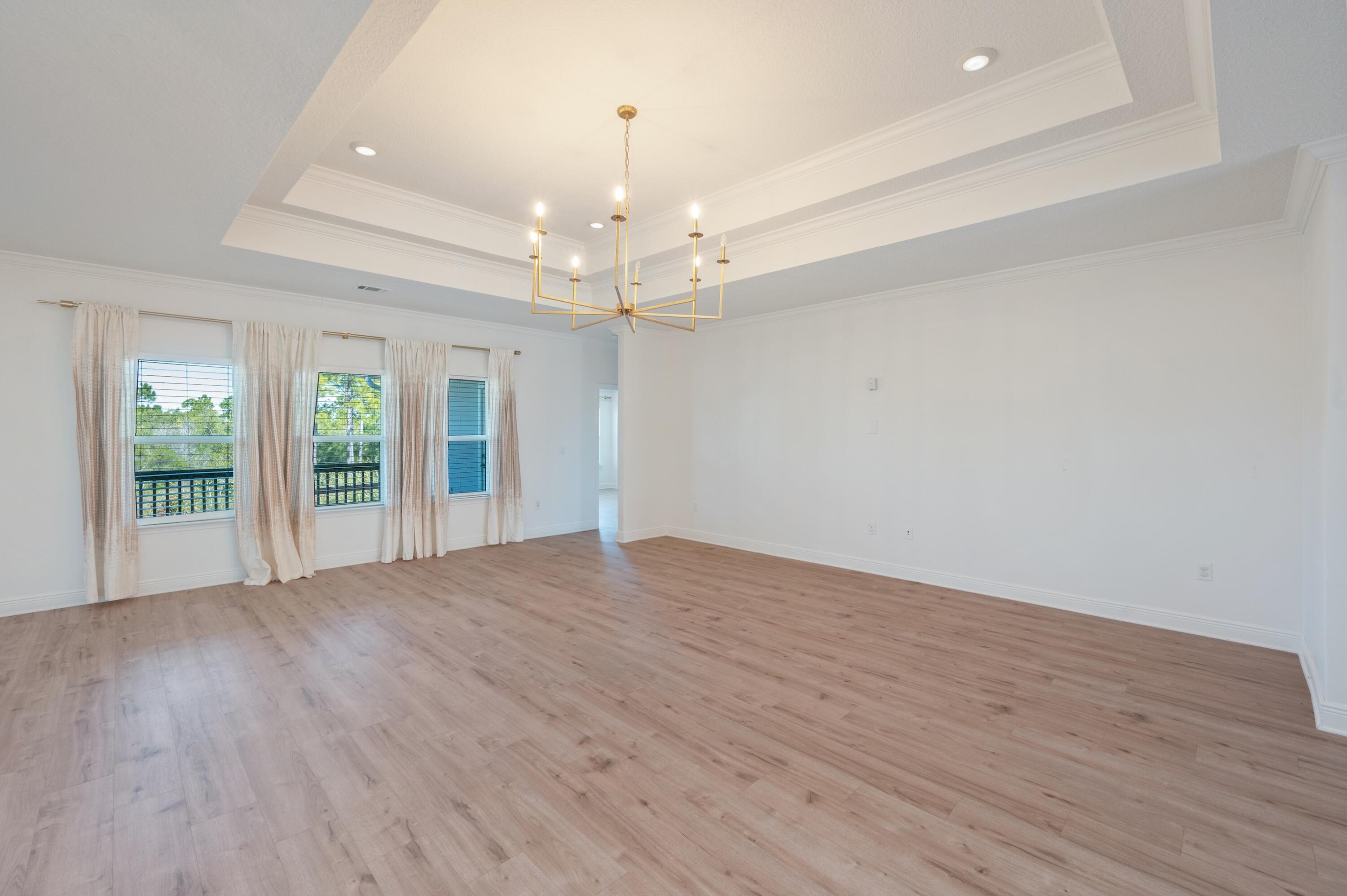 53 Palmer Lane Santa Rosa Beach, FL 32459 - Photo 18 of 62 a view of an empty room with wooden floor and a window