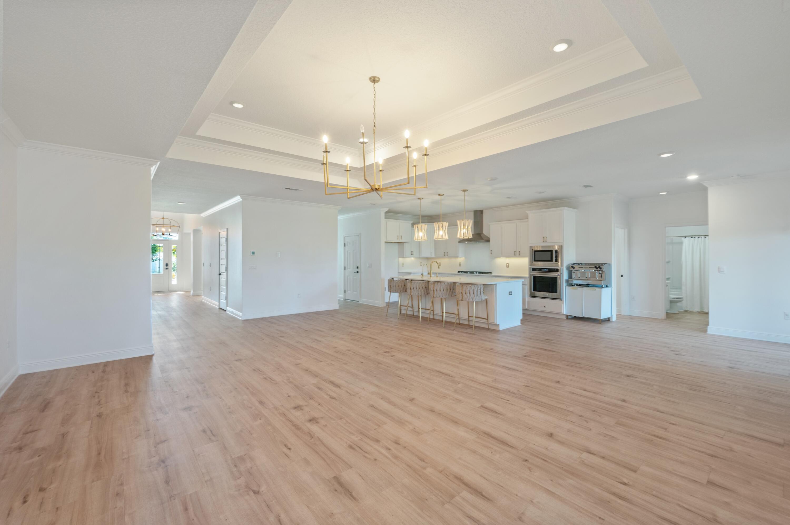 53 Palmer Lane Santa Rosa Beach, FL 32459 - Photo 21 of 62 a view of a kitchen with a sink and dishwasher a refrigerator with wooden floor