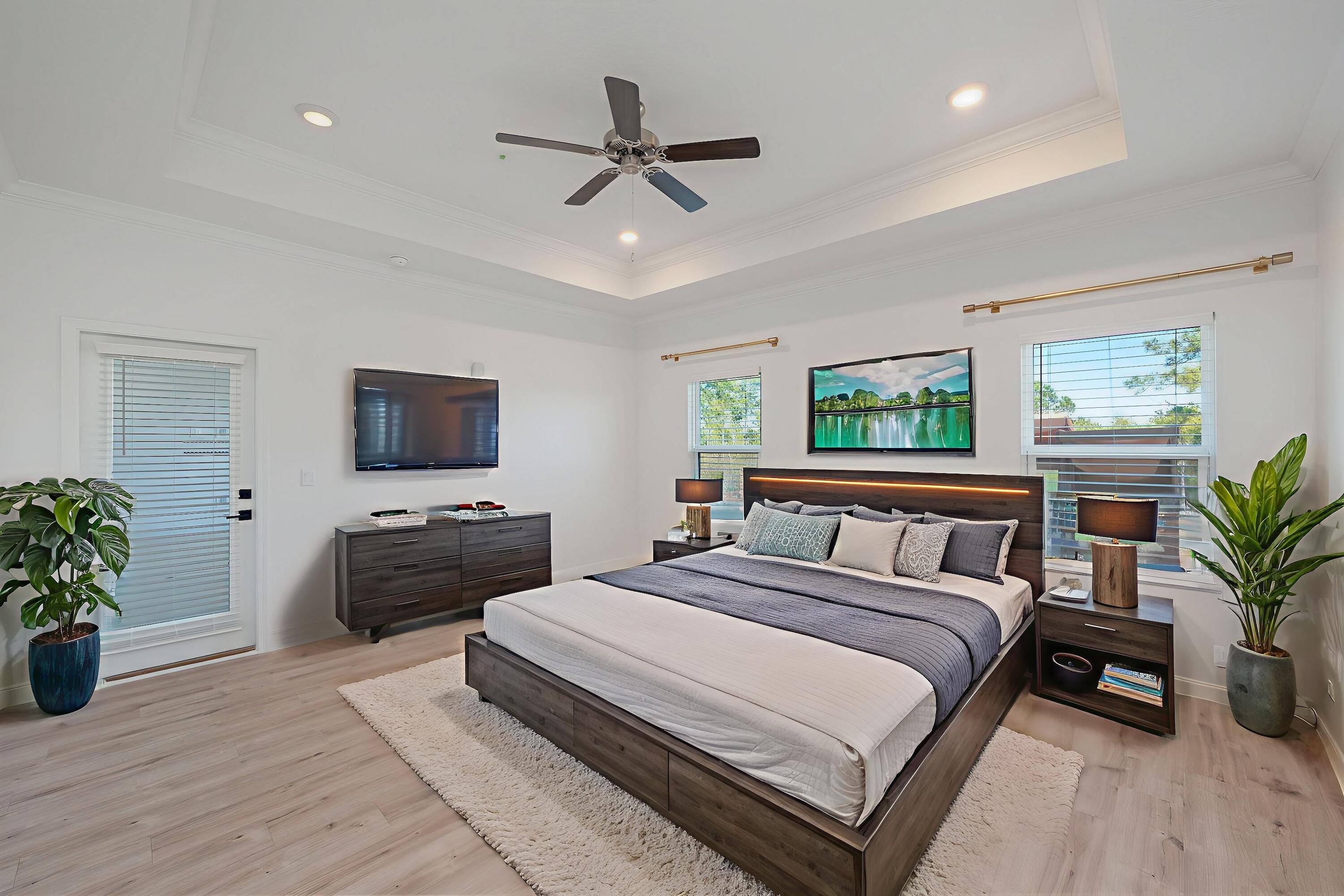 53 Palmer Lane Santa Rosa Beach, FL 32459 - Photo 26 of 62 a bedroom with a bed a couch and a flat screen tv