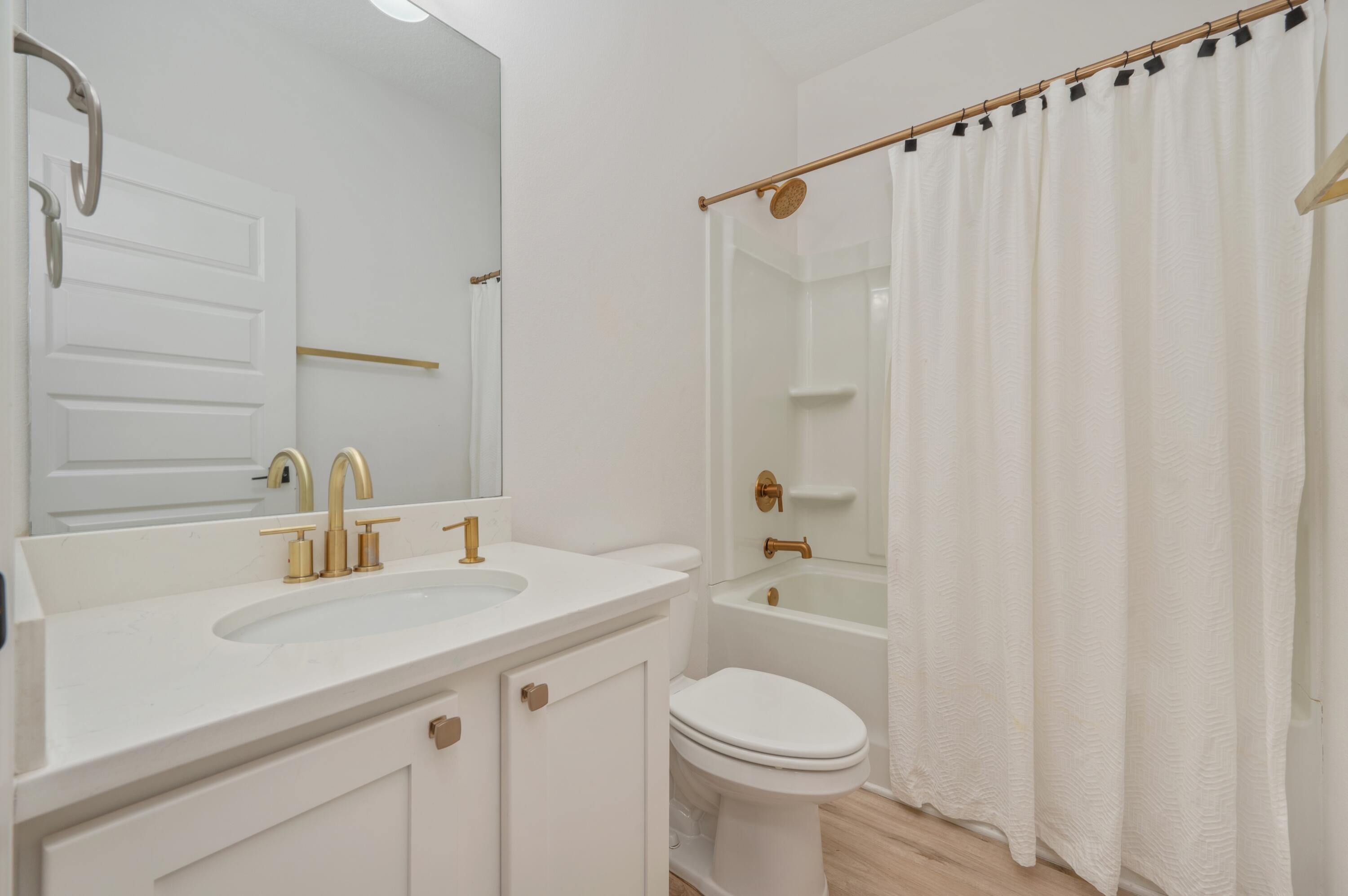 53 Palmer Lane Santa Rosa Beach, FL 32459 - Photo 36 of 62 a bathroom with a sink a toilet and shower