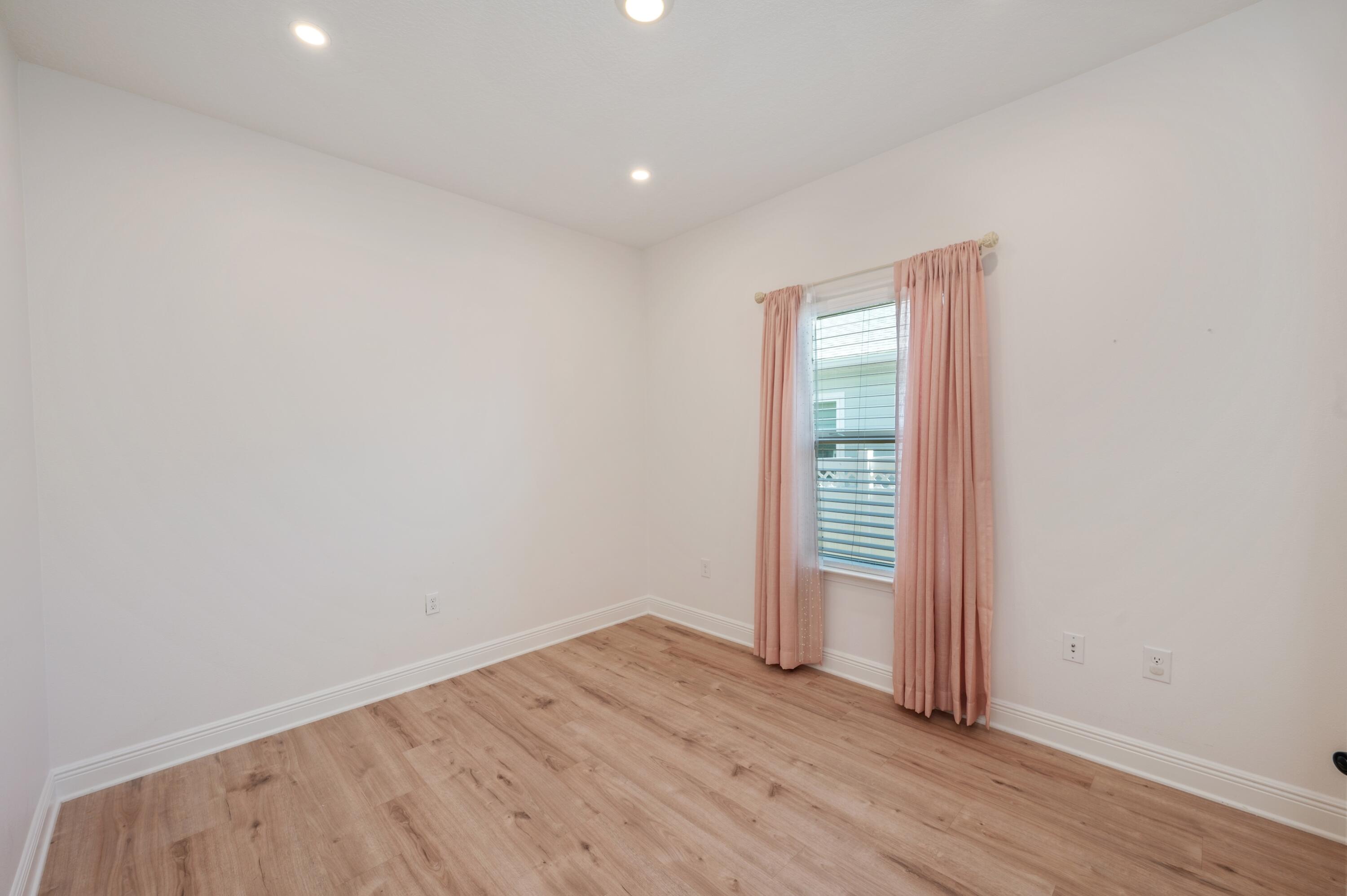 53 Palmer Lane Santa Rosa Beach, FL 32459 - Photo 38 of 62 an empty room with wooden floor and closet