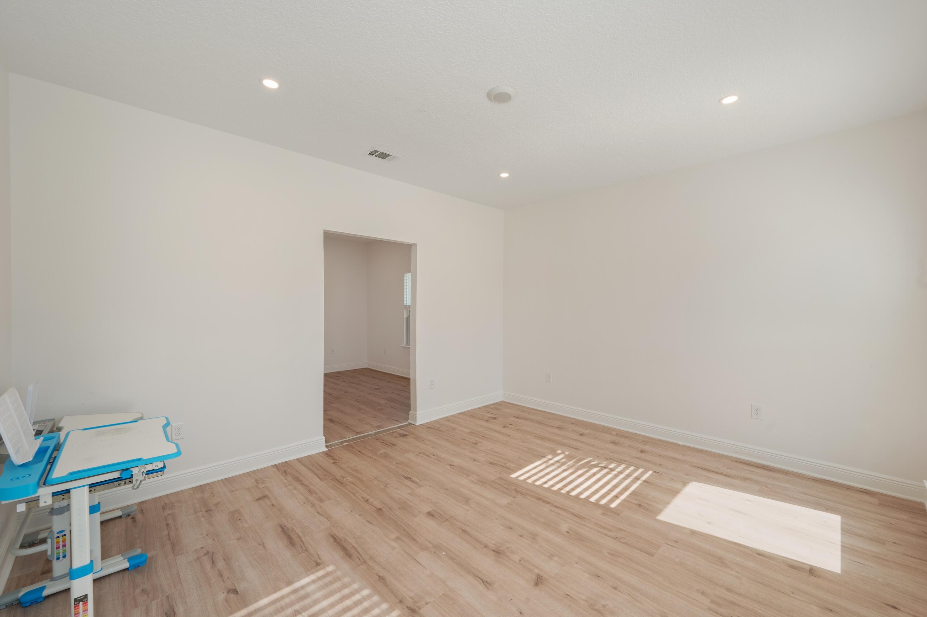 53 Palmer Lane Santa Rosa Beach, FL 32459 - Photo 44 of 62 a view of empty room with wooden floor