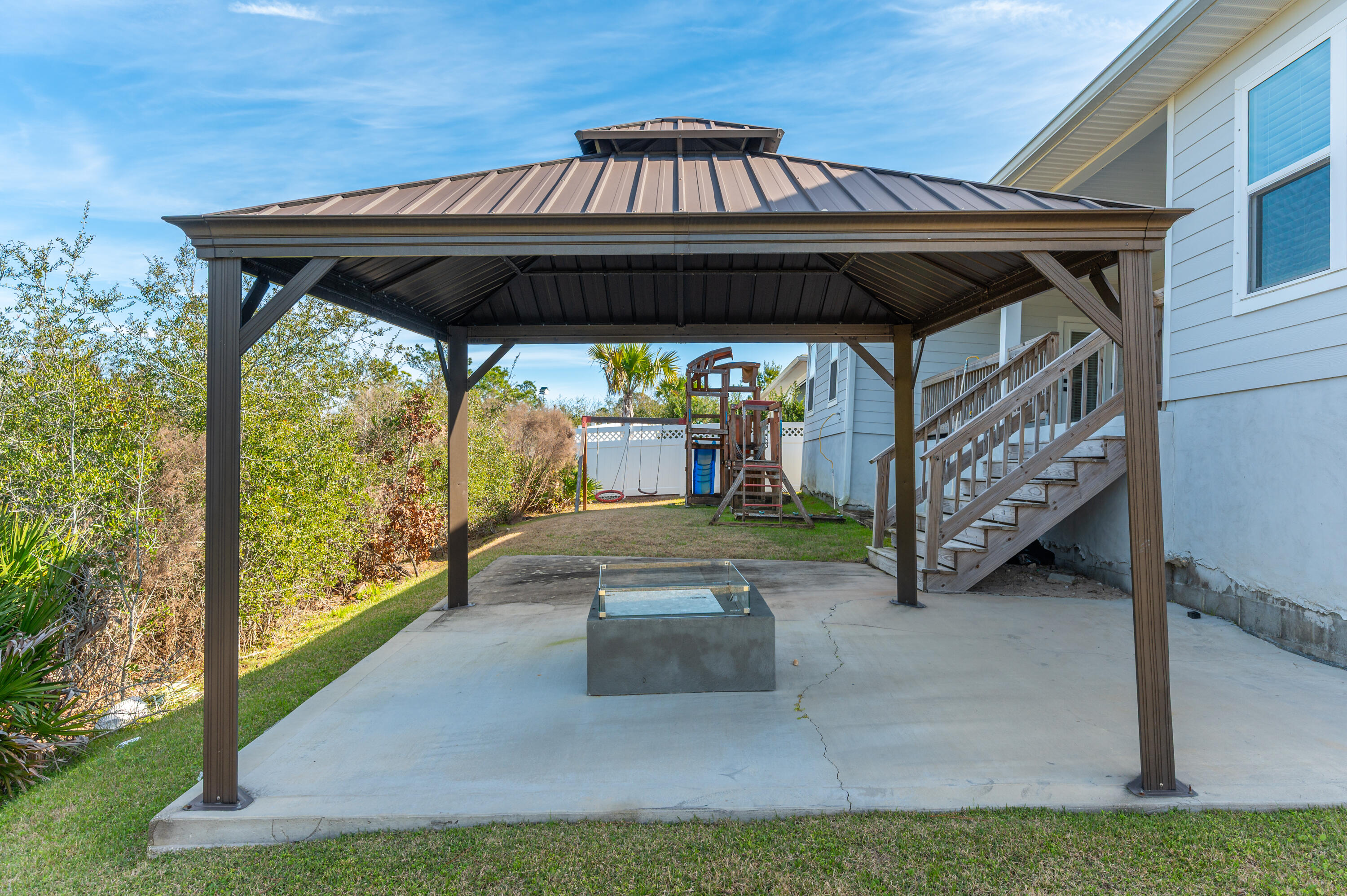 53 Palmer Lane Santa Rosa Beach, FL 32459 - Photo 54 of 62 a view of porch with a table and chairs under an umbrella