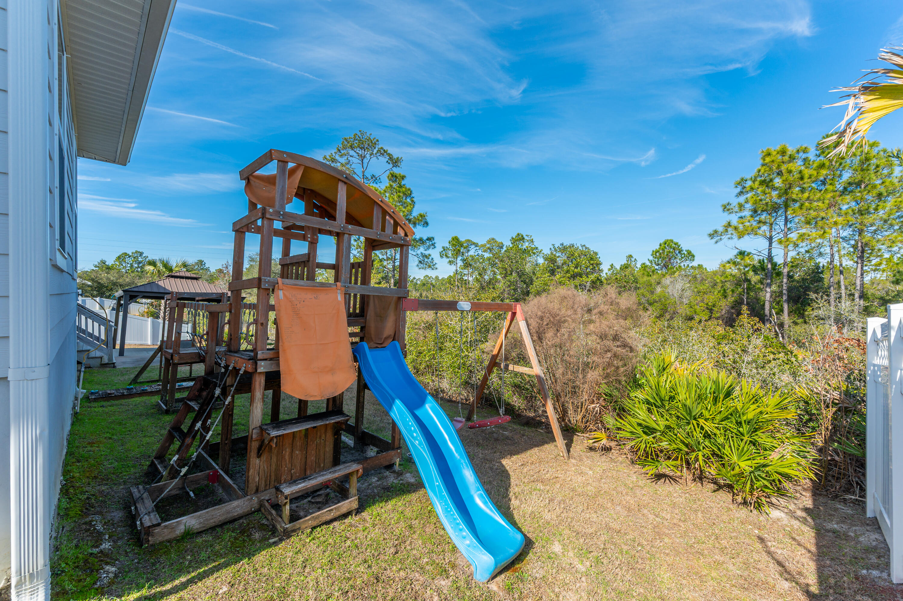 53 Palmer Lane Santa Rosa Beach, FL 32459 - Photo 56 of 62 a view of a house with backyard water fountain and sitting area
