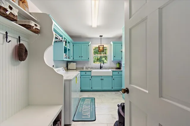 a living room with furniture a rug and a flat screen tv