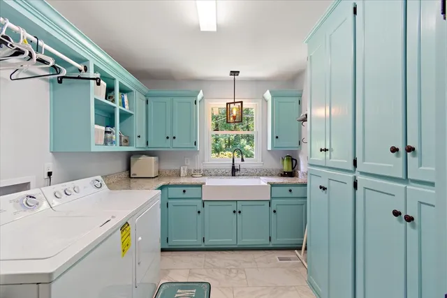 a living room with furniture a rug and a fireplace
