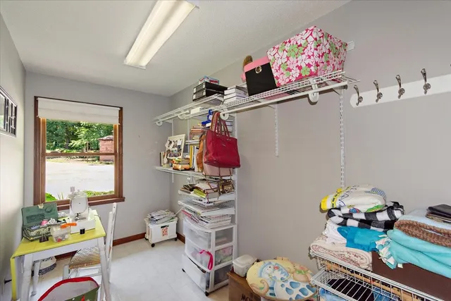 a bed room with a bed and a chandelier