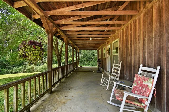 an aerial view of a house with a swimming pool