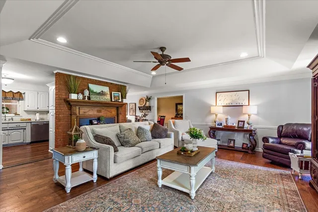 a living room with furniture and a fireplace