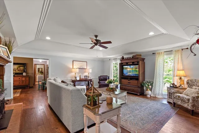 a living room with fireplace furniture and a flat screen tv