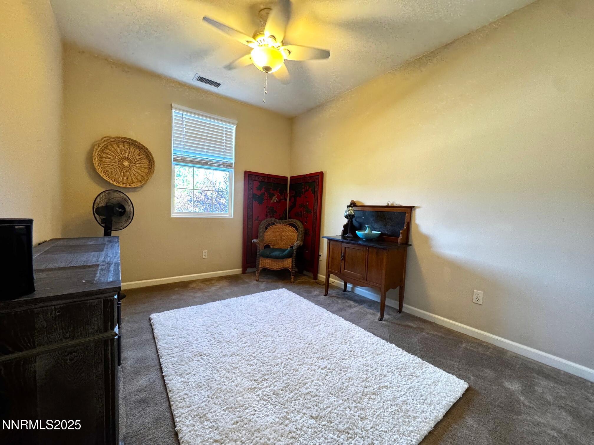 11044 Lamour Lane Reno, NV 89521 - Photo 14 of 21 a view of a workspace with furniture and a window