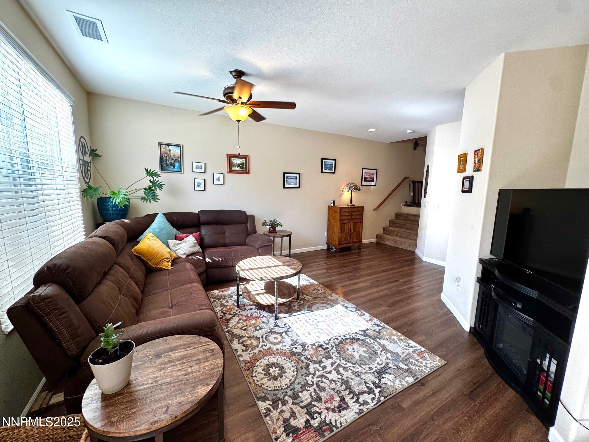 11044 Lamour Lane Reno, NV 89521 - Photo 7 of 21 a living room with furniture and a flat screen tv