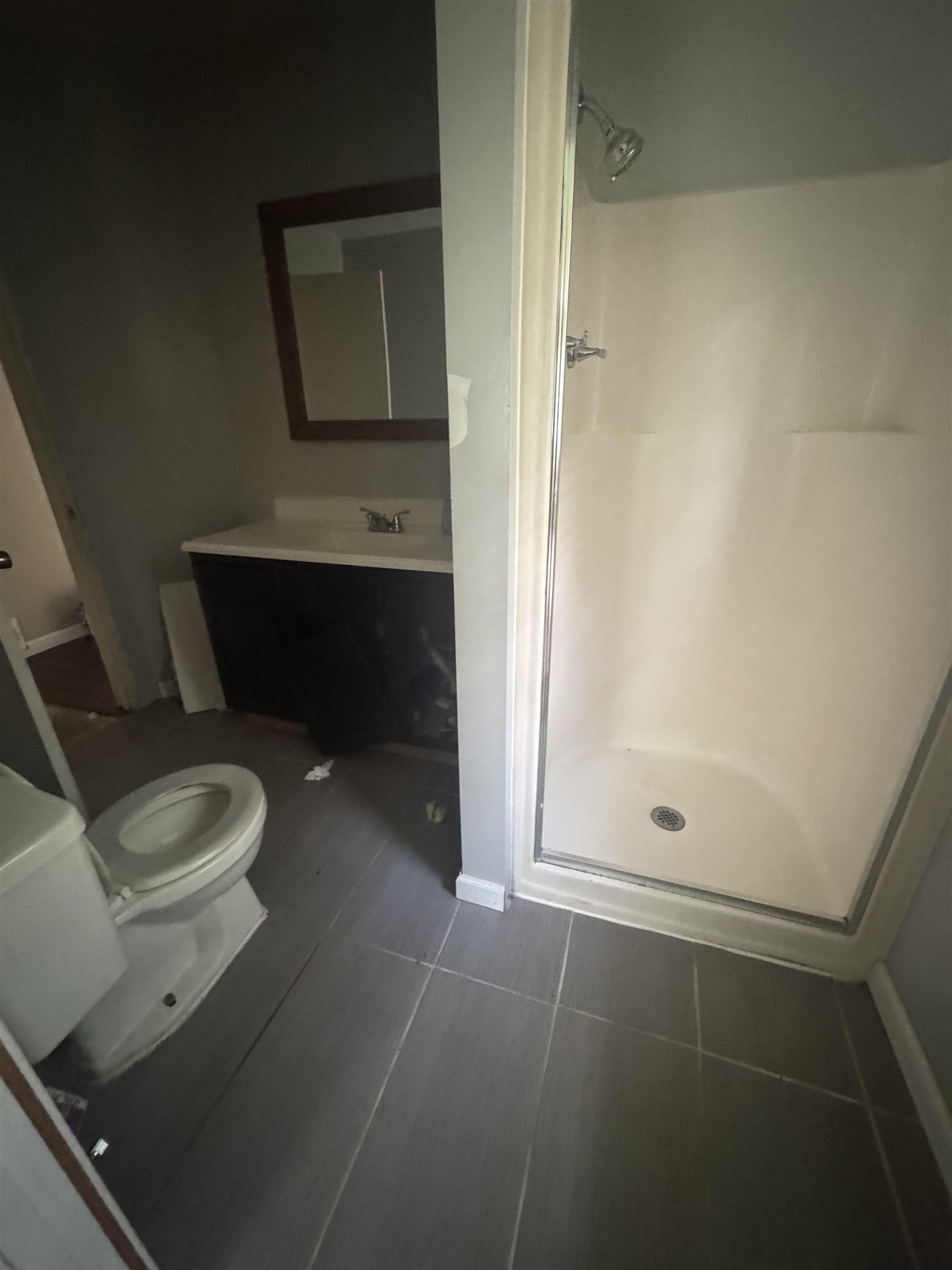 106 Cole Road Drummonds, TN 38023 - Photo 12 of 21 Bathroom featuring a walk-in shower with a glass enclosure, white shower surround, and a chrome shower head