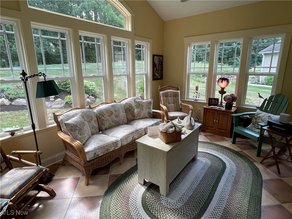 8322 Forest Ridge Street Northwest Massillon, OH 44646 - Photo 21 of 33 Sunroom featuring healthy amount of natural light and vaulted ceiling