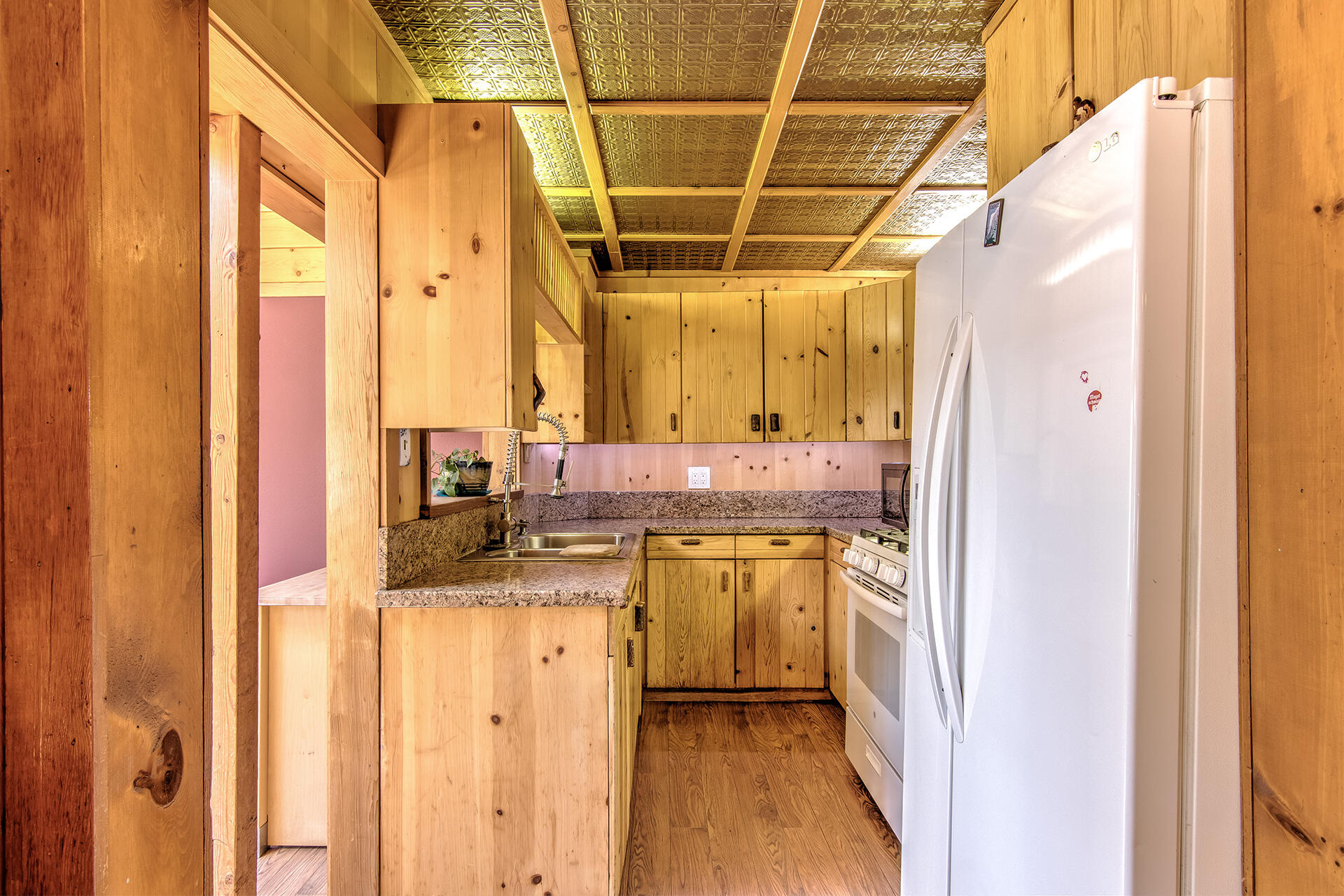 52890 Overlook Drive Idyllwild, CA 92549 - Photo 22 of 82 a bathroom with a granite countertop sink and a mirror