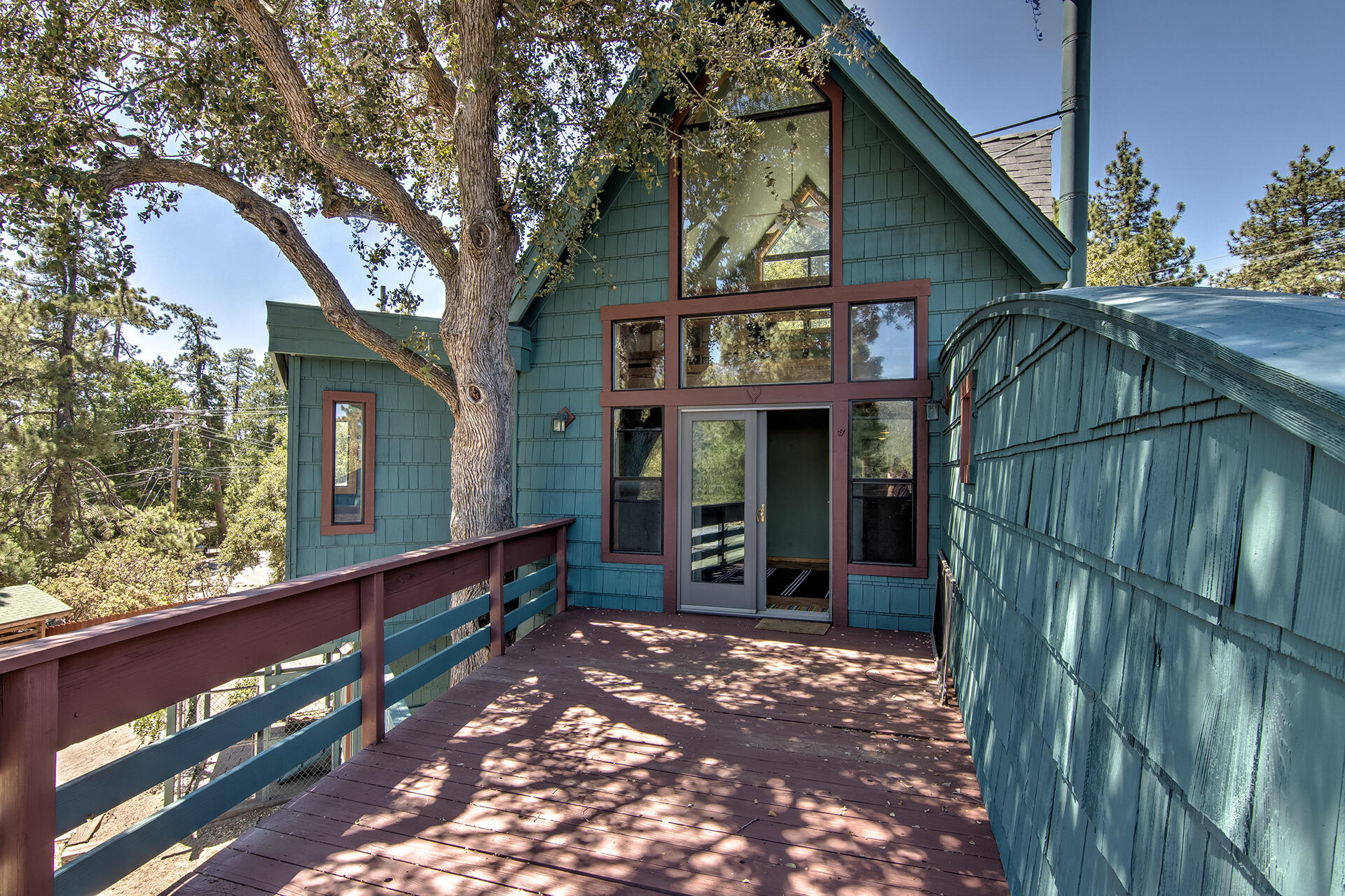 52890 Overlook Drive Idyllwild, CA 92549 - Photo 4 of 82 a view of a house with a large window and flower plants