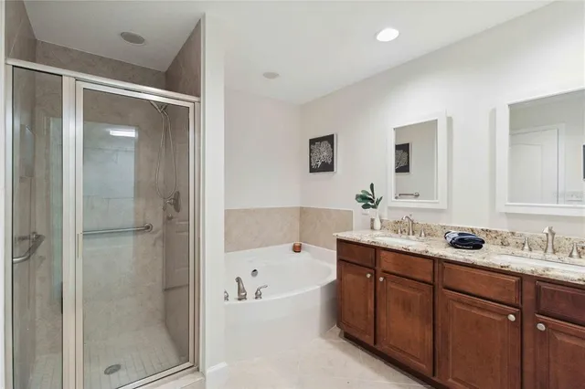 a bedroom with a bed and a potted plant