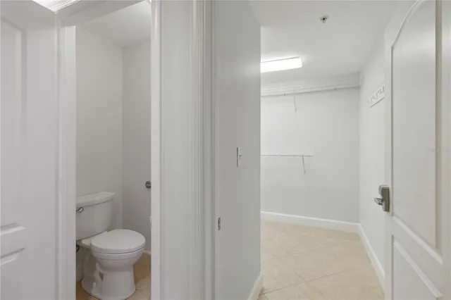 a view of a balcony with potted plants