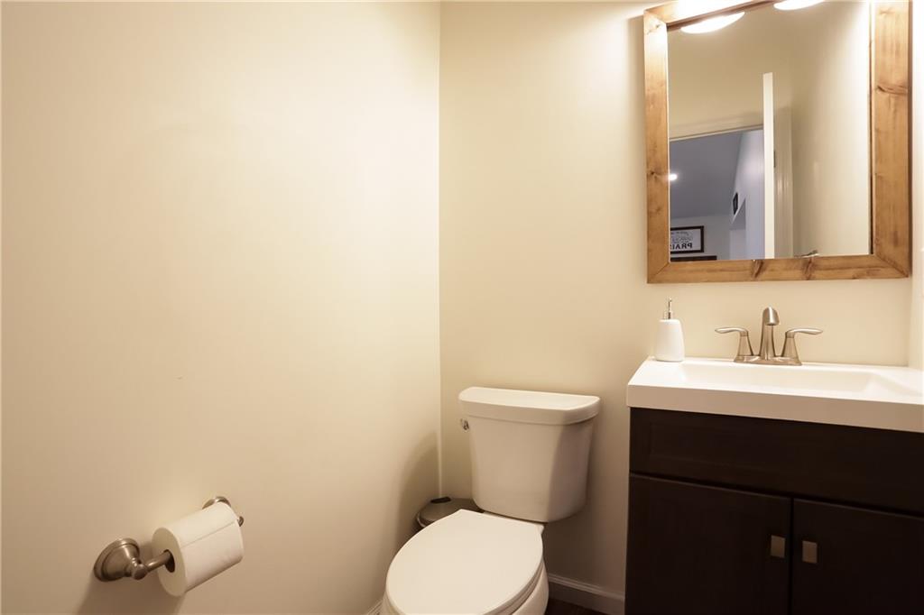 172 Bauder School Road Prospect, PA 16052 - Photo 19 of 25 a bathroom with a toilet a sink and mirror