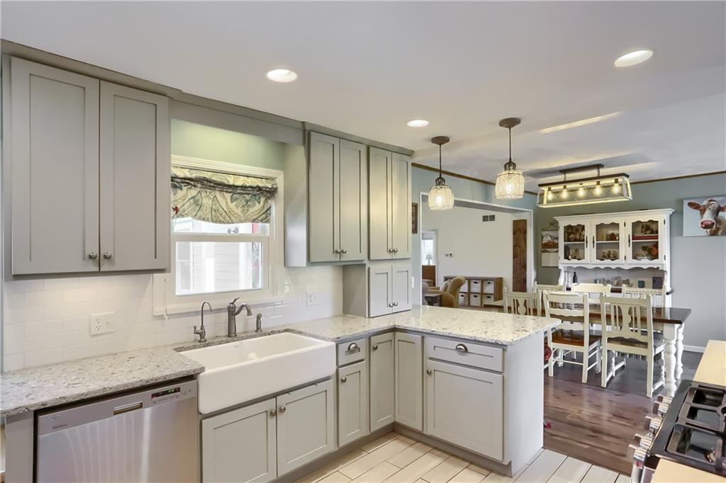 172 Bauder School Road Prospect, PA 16052 - Photo 8 of 25 a kitchen with a sink stove and cabinets
