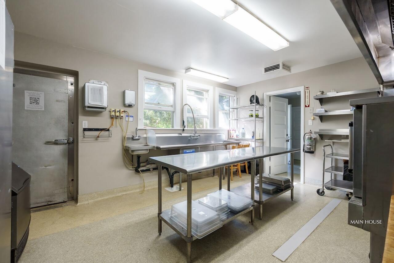 249 Lambert Road Carpinteria, CA 93013 - Photo 24 of 51 a room with a table chairs and a large window