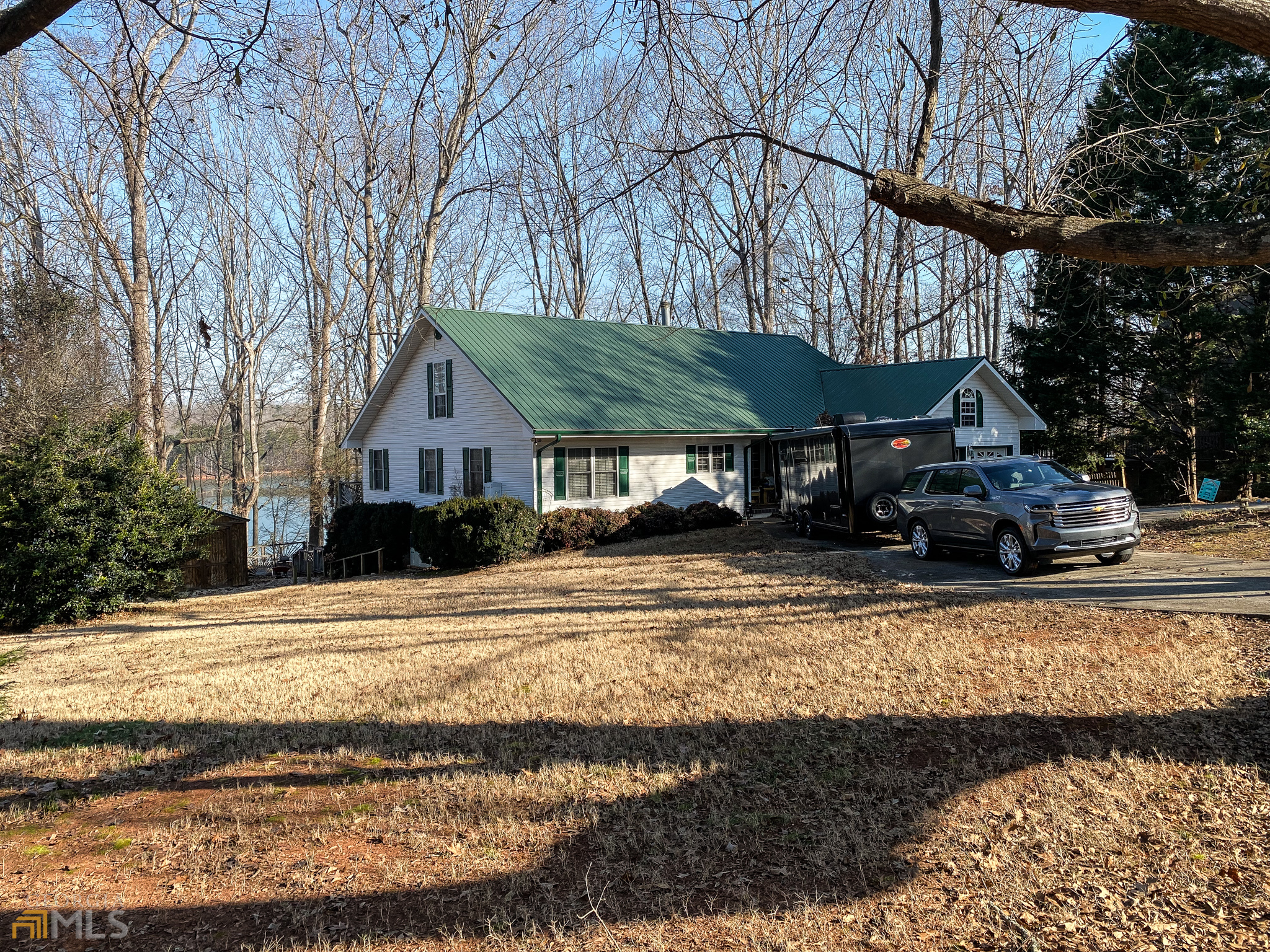 1498 Harbor Light Marina Road Lavonia, GA 30553 - Photo 1 of 1 a view of a house with snow on the side of the road