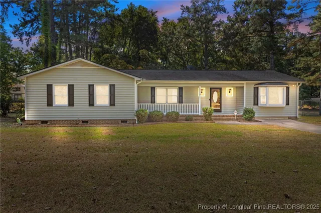 a front view of a house with yard