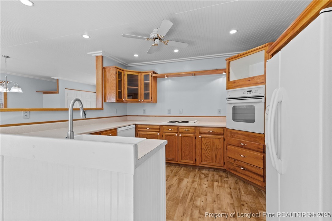 3560 School Road Fayetteville, NC 28306 - Photo 11 of 50 a kitchen with stainless steel appliances granite countertop a sink and a stove top oven