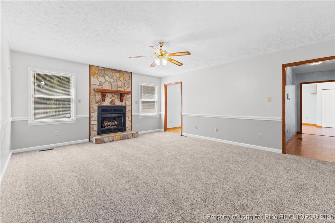 3560 School Road Fayetteville, NC 28306 - Photo 19 of 50 an empty room with windows and fireplace