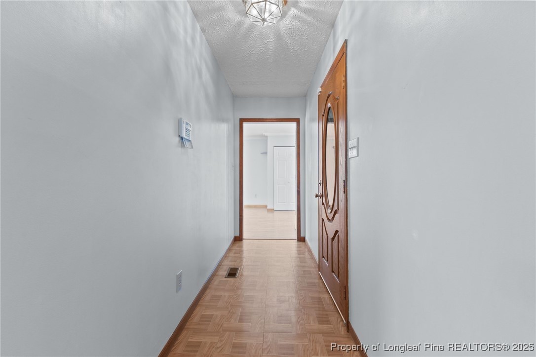 3560 School Road Fayetteville, NC 28306 - Photo 20 of 50 a view of a hallway with a chandelier