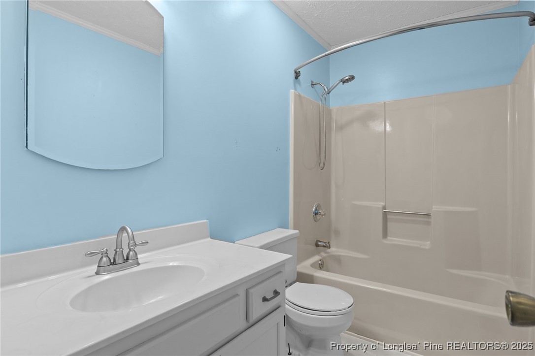 3560 School Road Fayetteville, NC 28306 - Photo 21 of 50 a bathroom with a sink toilet and shower