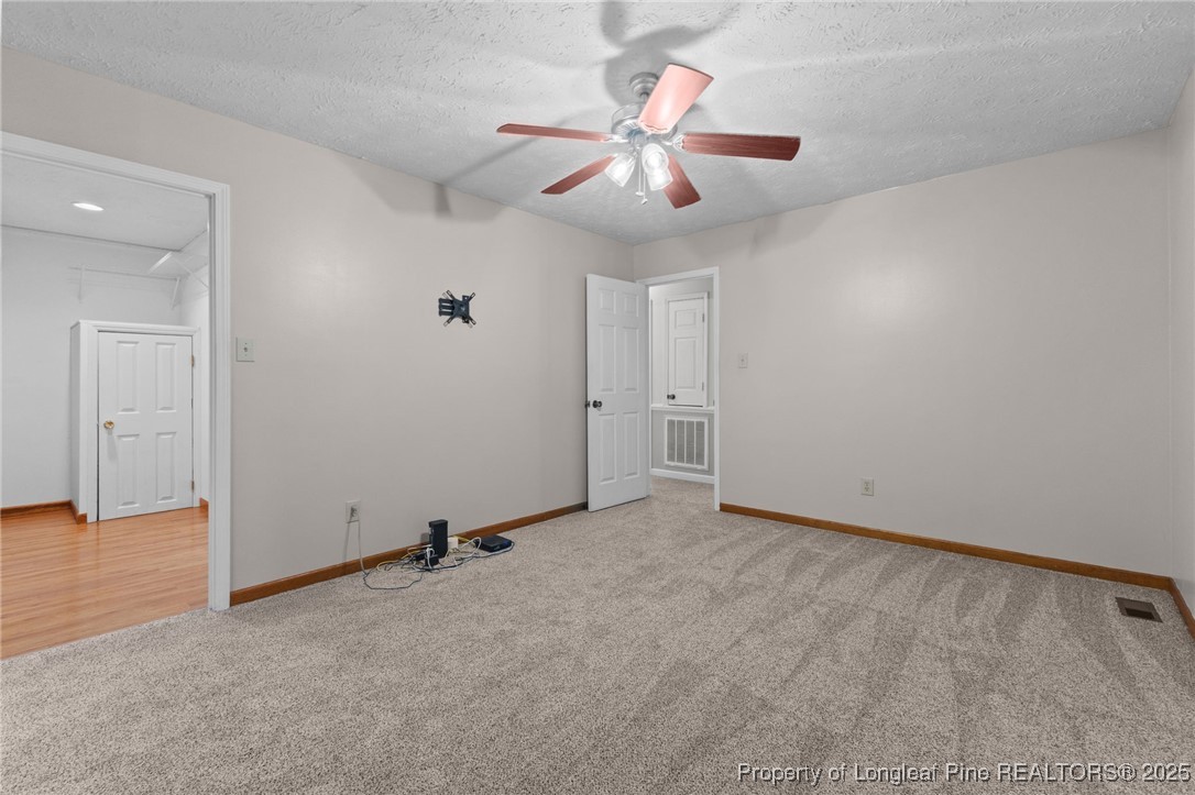 3560 School Road Fayetteville, NC 28306 - Photo 23 of 50 an empty room with closet and windows