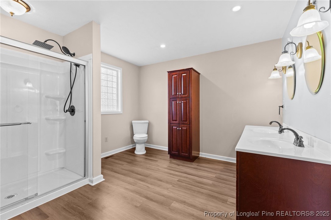 3560 School Road Fayetteville, NC 28306 - Photo 25 of 50 a bathroom with a sink and a mirror