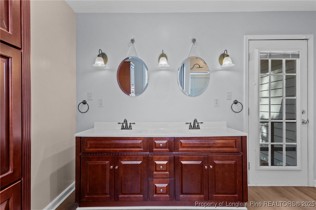 3560 School Road Fayetteville, NC 28306 - Photo 27 of 50 a bathroom with a sink and a mirror