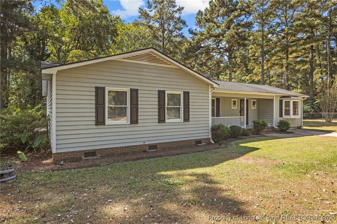 3560 School Road Fayetteville, NC 28306 - Photo 4 of 50 a view of a house with a yard