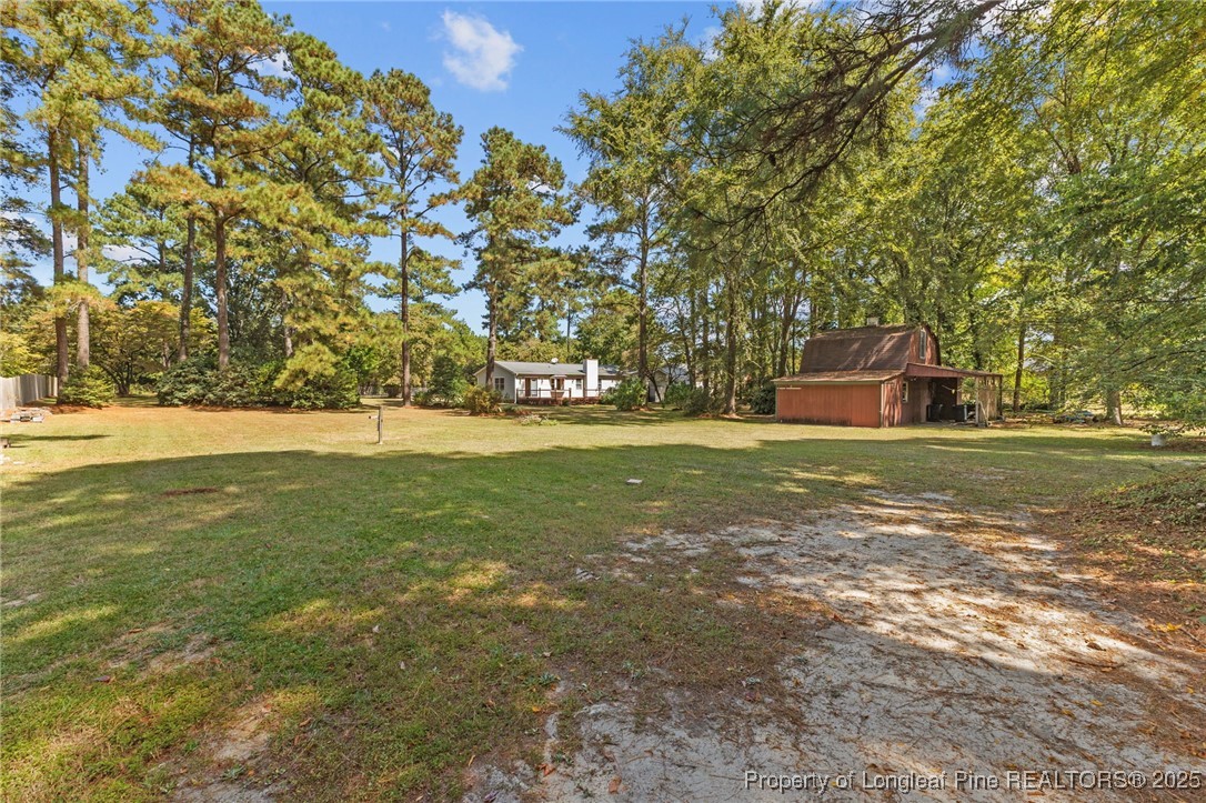 3560 School Road Fayetteville, NC 28306 - Photo 46 of 50 a view of a field with trees in the background