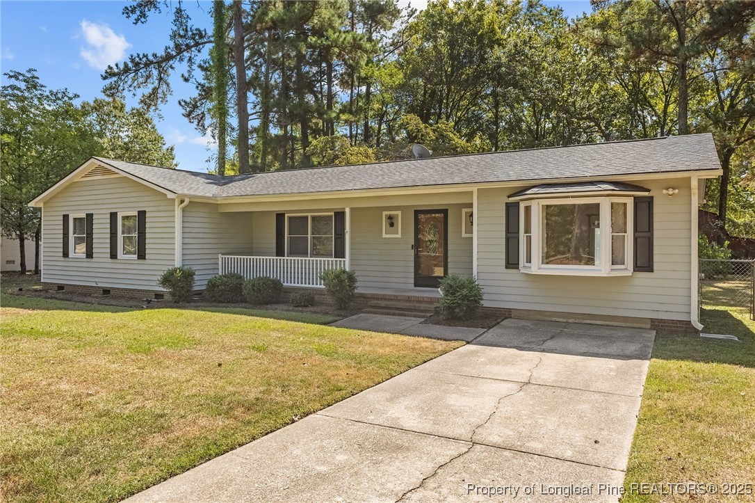 3560 School Road Fayetteville, NC 28306 - Photo 5 of 50 a front view of a house with a yard