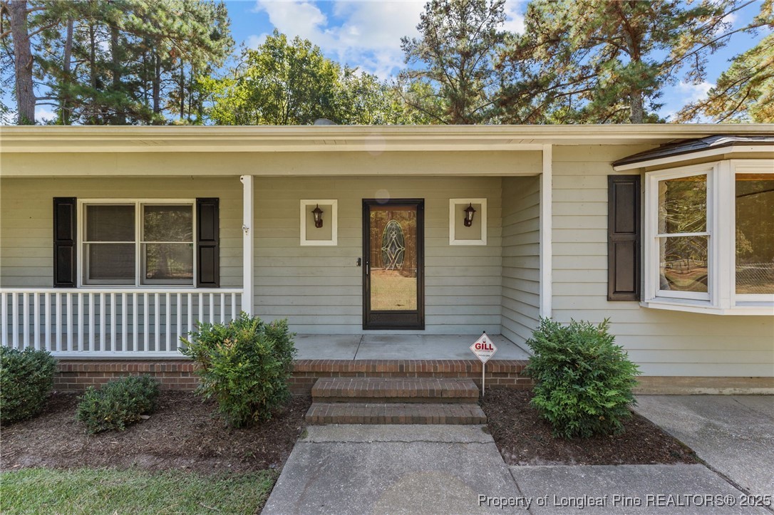 3560 School Road Fayetteville, NC 28306 - Photo 6 of 50 a front view of a house with a yard