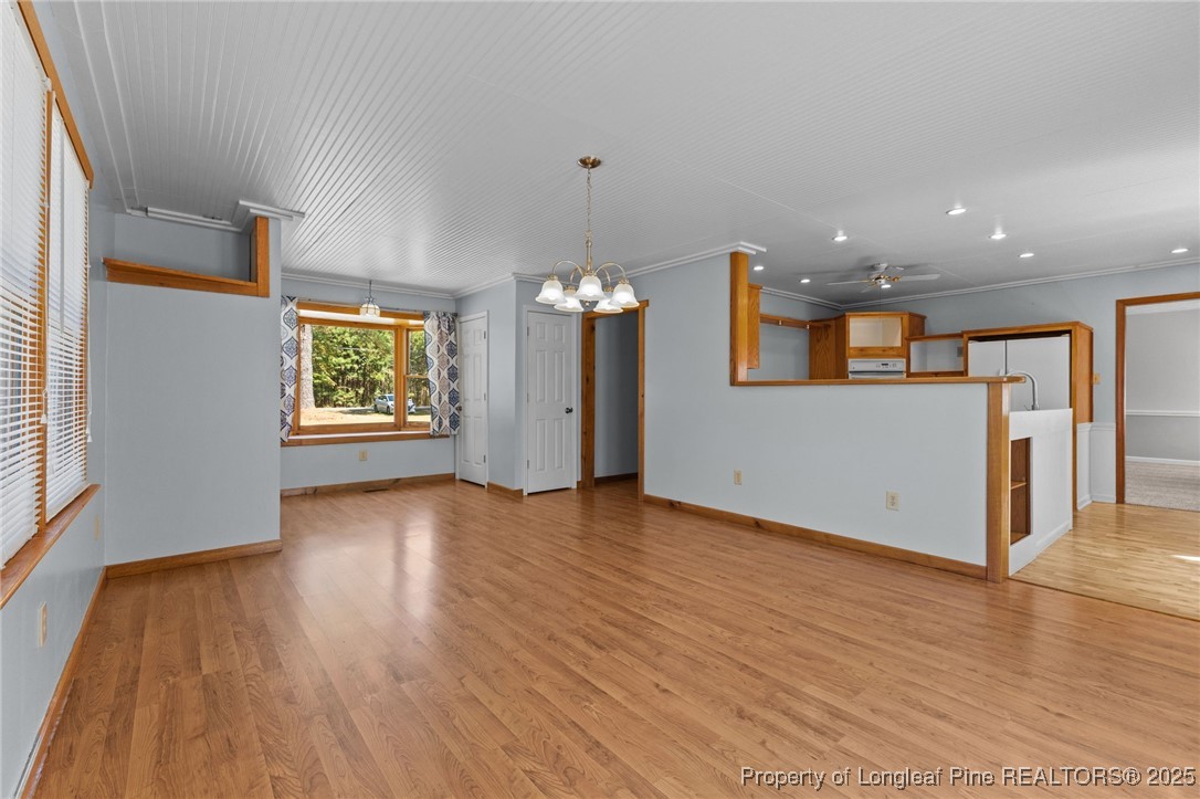 3560 School Road Fayetteville, NC 28306 - Photo 8 of 50 an empty room with wooden floor and windows