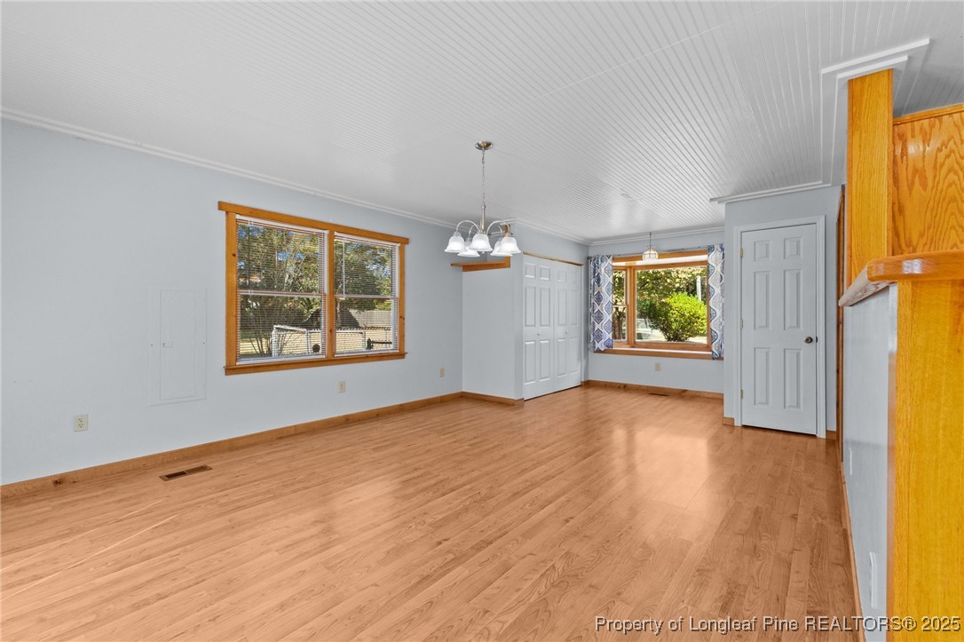 3560 School Road Fayetteville, NC 28306 - Photo 9 of 50 a view of an empty room with window and wooden floor