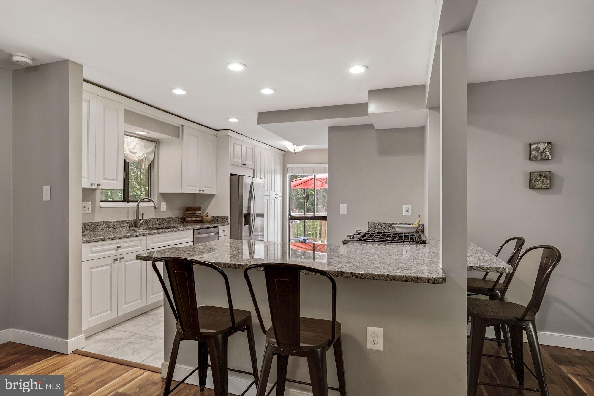 2119 Thomas View Road Reston, VA 20191 - Photo 10 of 41 a kitchen with a table and chairs in it