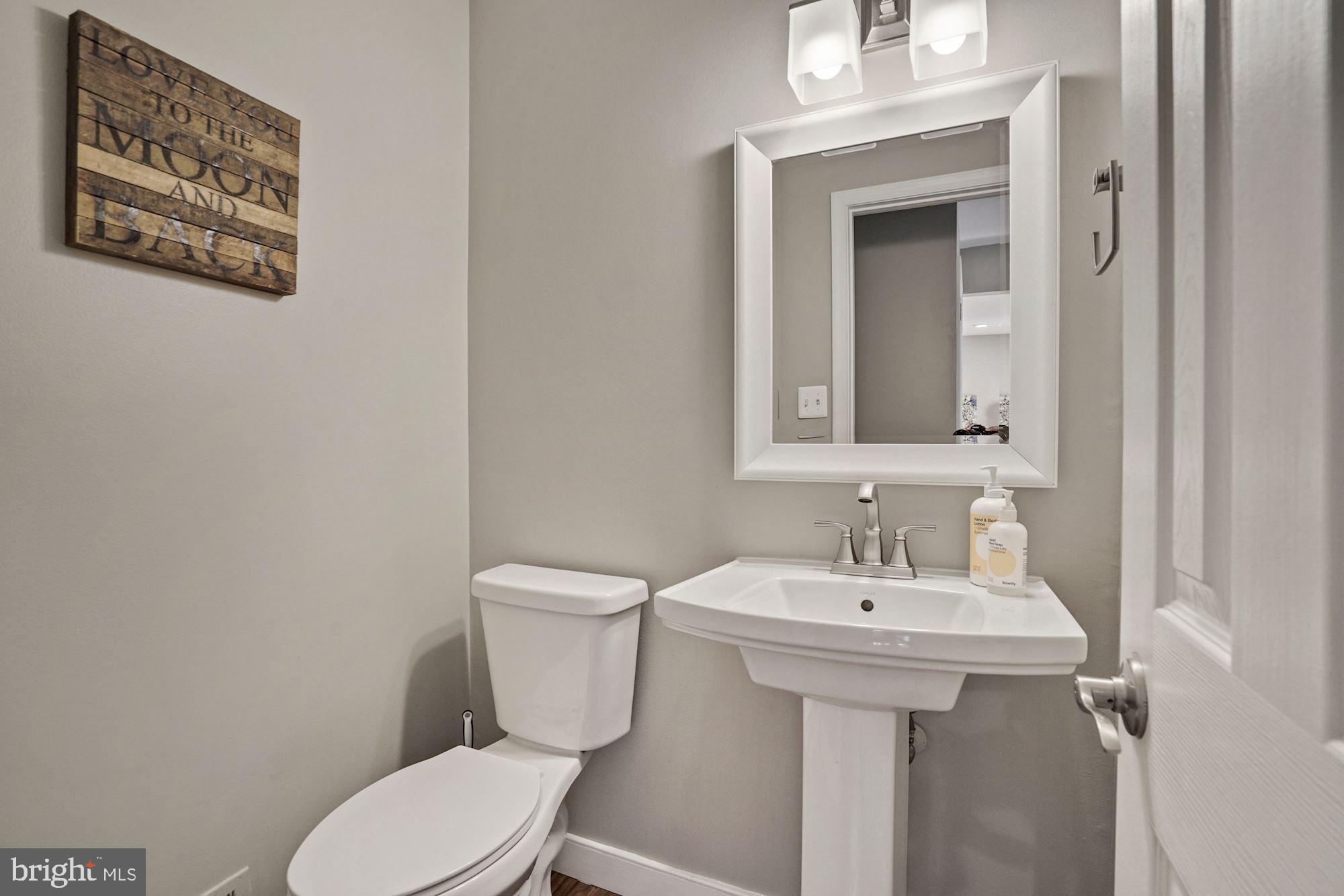 2119 Thomas View Road Reston, VA 20191 - Photo 14 of 41 a bathroom with a toilet sink and mirror